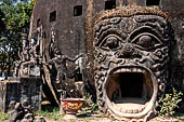 Vientiane , Laos. The Buddha Park (Xiang Khouan), giant pumpkin with a large open mouth serving as the entrance 